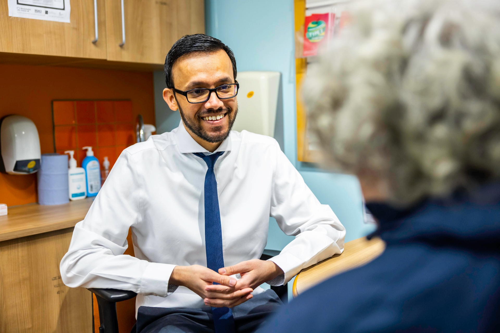 Lead pharmacist in a consultation room with a patient